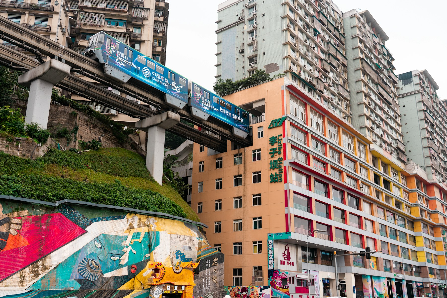 A monorail passing through the dense buildings of Chongqing’s Liziba district